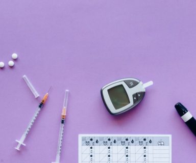 Different diabetes medications on a purple background.